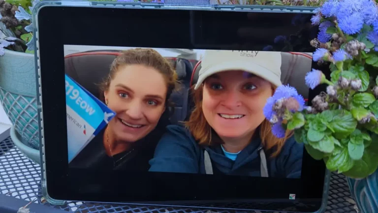 A YouTube video by the Taylor and Amy Show is playing on an iPad sitting on a shelf in the garden.